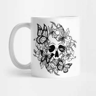 Skull behind lilies and butterflies Mug